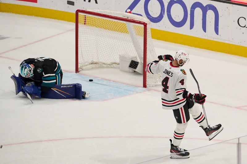 Mar 23, 2024; San Jose, California, USA; Chicago Blackhawks defenseman Seth Jones (4) reacts after scoring the game-winning goal against San Jose Sharks goaltender Devin Cooley (1) during the overtime period at SAP Center at San Jose. Mandatory Credit: Robert Edwards-USA TODAY Sports