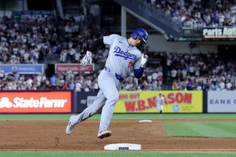 Jun 7, 2024; Bronx, New York, USA; Los Angeles Dodgers designated hitter Shohei Ohtani (17) rounds third base and scores against the New York Yankees on a double by left fielder Teoscar Hernandez (not pictured) during the eleventh inning at Yankee Stadium. Mandatory Credit: Brad Penner-USA TODAY Sports