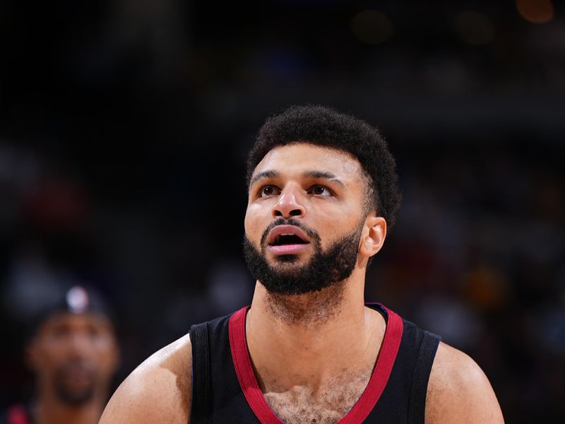 DENVER, CO - JANUARY 7: Jamal Murray #27 of the Denver Nuggets shoots a free throw during the game against the Detroit Pistons on January 7, 2024 at the Ball Arena in Denver, Colorado. NOTE TO USER: User expressly acknowledges and agrees that, by downloading and/or using this Photograph, user is consenting to the terms and conditions of the Getty Images License Agreement. Mandatory Copyright Notice: Copyright 2024 NBAE (Photo by Garrett Ellwood/NBAE via Getty Images)