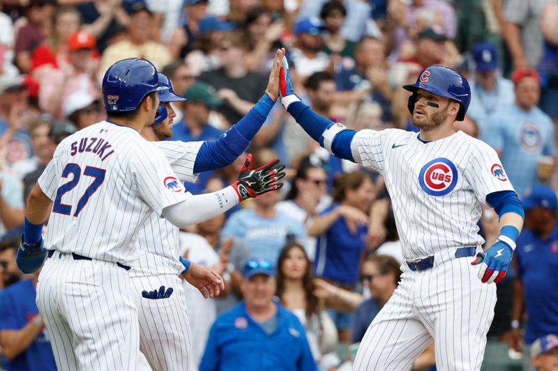 Jul 4, 2024; Chicago, Illinois, USA; Chicago Cubs outfielder Ian Happ (8) celebrates with teammates after hitting a three-run home run against the Philadelphia Phillies during the fifth inning at Wrigley Field. Mandatory Credit: Kamil Krzaczynski-USA TODAY Sports