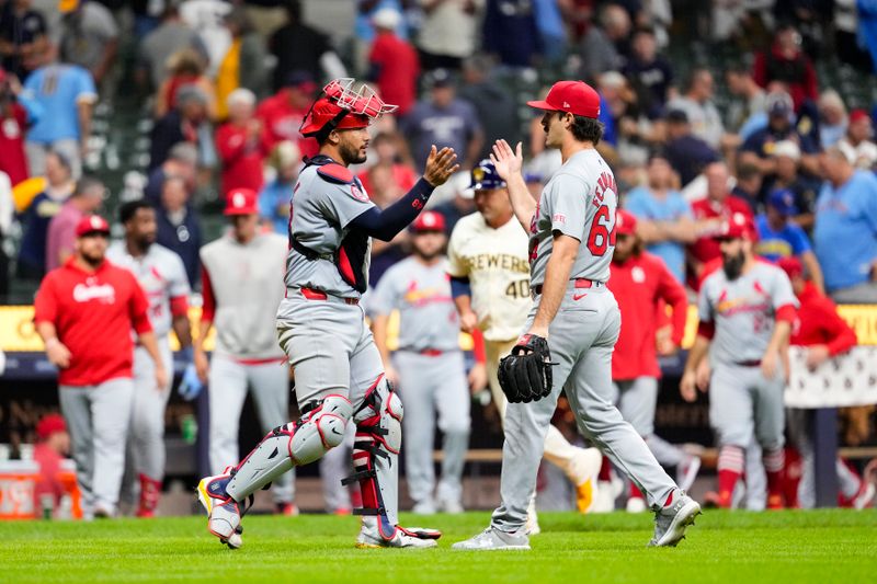 Sep 4, 2024; Milwaukee, Wisconsin, USA;  St. Louis Cardinals pitcher Ryan Fernandez (64) greets catcher Ivan Herrera (48) following the game against the Milwaukee Brewers at American Family Field. Mandatory Credit: Jeff Hanisch-Imagn Images