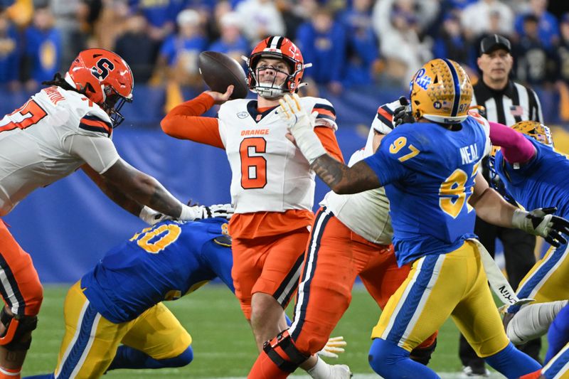 Oct 24, 2024; Pittsburgh, Pennsylvania, USA; Syracuse Orange quarterback Kyle McCord (6) throws a pass during the first quarter in front of Pittsburgh Panthers defensive lineman Isaiah Neal (97) at Acrisure Stadium. Mandatory Credit: Barry Reeger-Imagn Images