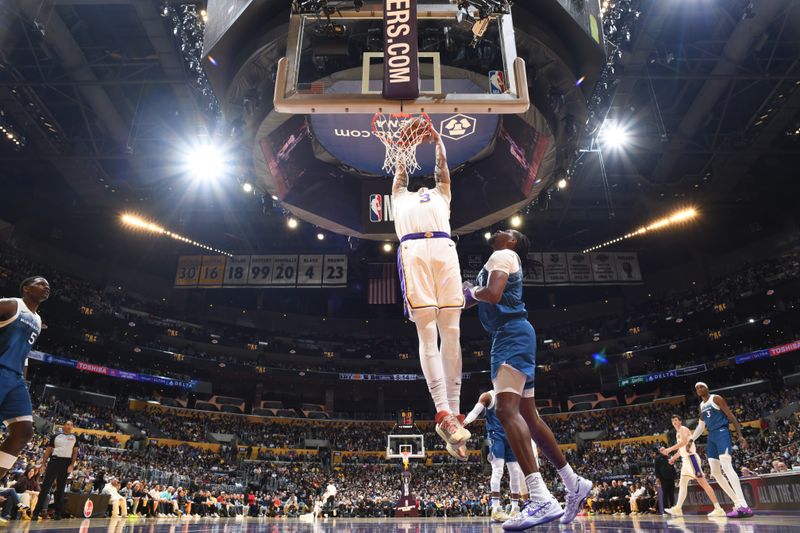 LOS ANGELES, CA - MARCH 10: Anthony Davis #3 of the Los Angeles Lakers dunks the ball during the game against the Minnesota Timberwolves on March 10, 2024 at Crypto.Com Arena in Los Angeles, California. NOTE TO USER: User expressly acknowledges and agrees that, by downloading and/or using this Photograph, user is consenting to the terms and conditions of the Getty Images License Agreement. Mandatory Copyright Notice: Copyright 2024 NBAE (Photo by Adam Pantozzi/NBAE via Getty Images)