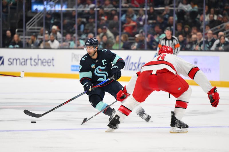 Oct 26, 2024; Seattle, Washington, USA; Seattle Kraken right wing Jordan Eberle (7) plays the puck during the third period against the Carolina Hurricanes at Climate Pledge Arena. Mandatory Credit: Steven Bisig-Imagn Images