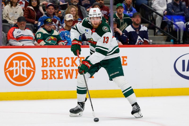 Feb 26, 2026; Denver, Colorado, USA; Minnesota Wild center Yakov Trenin (13) controls the puck in the second period against the Colorado Avalanche at Ball Arena. Mandatory Credit: Isaiah J. Downing-Imagn Images
