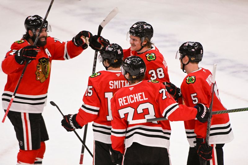 Mar 3, 2025; Chicago, Illinois, USA;  Chicago Blackhawks defenseman Ethan Del Mastro (38), center, celebrates his goal against the Los Angeles Kings with teammates during the second period at the United Center. Mandatory Credit: Matt Marton-Imagn Images