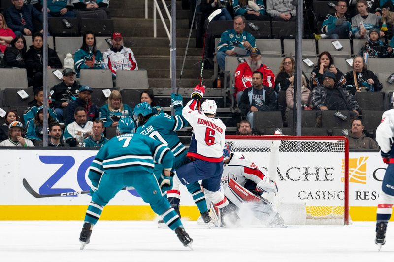 Nov 27, 2023; San Jose, California, USA; San Jose Sharks left wing Anthony Duclair (10) and Washington Capitals defenseman Joel Edmundson (6) battle for position in front of the net during the first period at SAP Center at San Jose. Mandatory Credit: Neville E. Guard-USA TODAY Sports