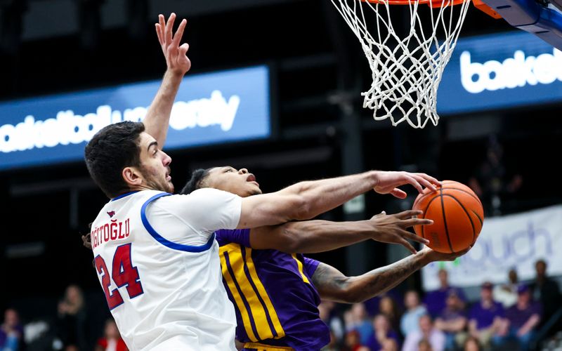 Dec 14, 2024; Frisco, Texas, USA;  LSU Tigers guard Jordan Sears (1) shoots as Southern Methodist Mustangs center Samet Yigitoglu (24) defends during the second half at Comerica Center. Mandatory Credit: Kevin Jairaj-Imagn Images