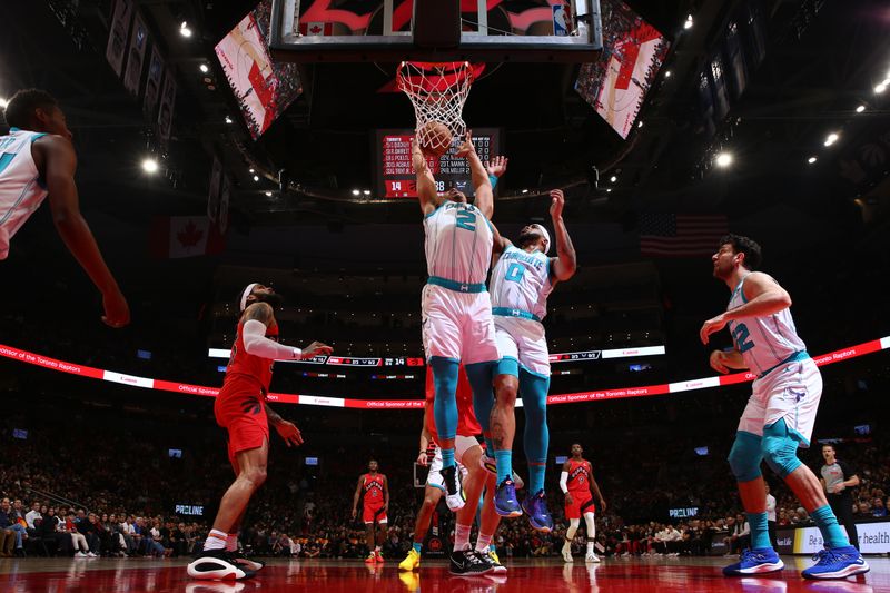 TORONTO, CANADA - MARCH 3: Grant Williams #2 of the Charlotte Hornets drives to the basket during the game against the Toronto Raptors on March 3, 2024 at the Scotiabank Arena in Toronto, Ontario, Canada.  NOTE TO USER: User expressly acknowledges and agrees that, by downloading and or using this Photograph, user is consenting to the terms and conditions of the Getty Images License Agreement.  Mandatory Copyright Notice: Copyright 2024 NBAE (Photo by Vaughn Ridley/NBAE via Getty Images)