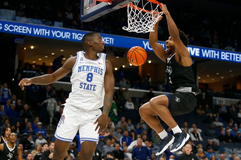 Jan 31, 2024; Memphis, Tennessee, USA; Rice Owls guard Anthony Selden (4) dunks during the second half against the Memphis Tigers at FedExForum. Mandatory Credit: Petre Thomas-USA TODAY Sports