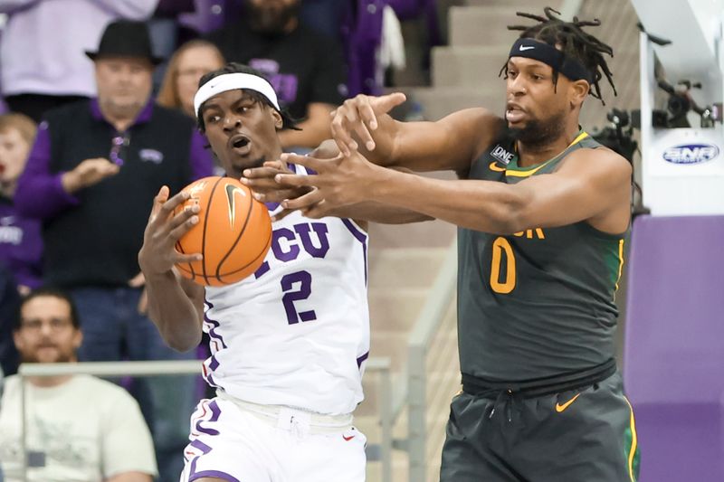 Feb 11, 2023; Fort Worth, Texas, USA;  TCU Horned Frogs forward Emanuel Miller (2) and Baylor Bears forward Flo Thamba (0) go for the ball during the first half at Ed and Rae Schollmaier Arena. Mandatory Credit: Kevin Jairaj-USA TODAY Sports