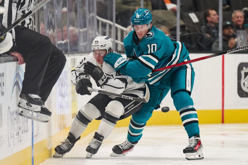 Apr 4, 2024; San Jose, California, USA; San Jose Sharks center Klim Kostin (10) checks Los Angeles Kings center Blake Lizotte (46) into the boards during the third period at SAP Center at San Jose. Mandatory Credit: Robert Edwards-USA TODAY Sports