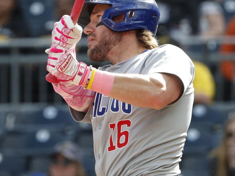 May 12, 2024; Pittsburgh, Pennsylvania, USA;  Chicago Cubs first baseman Patrick Wisdom (16) hits a solo home  run against the Pittsburgh Pirates during the tenth inning at PNC Park. The Cubs won 5-4 in ten innings. Mandatory Credit: Charles LeClaire-USA TODAY Sports