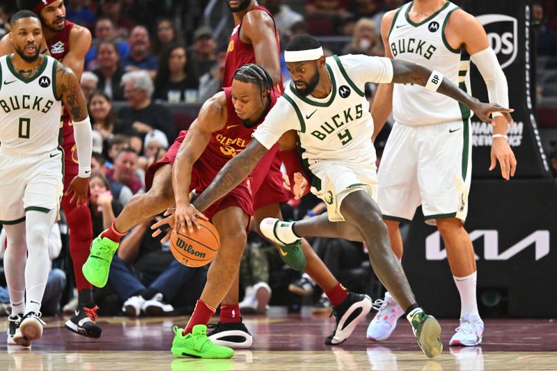 CLEVELAND, OHIO - NOVEMBER 04: Isaac Okoro #35 of the Cleveland Cavaliers fights for a loose ball with Bobby Portis #9 of the Milwaukee Bucks during the first quarter at Rocket Mortgage Fieldhouse on November 04, 2024 in Cleveland, Ohio. NOTE TO USER: User expressly acknowledges and agrees that, by downloading and or using this photograph, User is consenting to the terms and conditions of the Getty Images License Agreement. (Photo by Jason Miller/Getty Images)