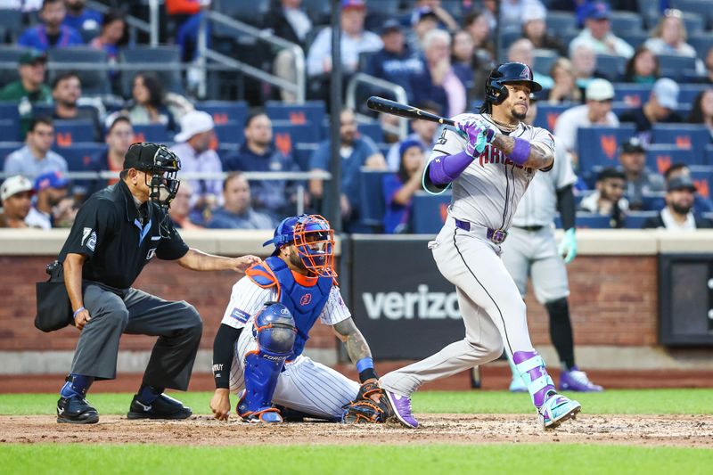 May 30, 2024; New York City, New York, USA; Arizona Diamondbacks second baseman Ketel Marte (4) hits a two run double in the third inning against the New York Mets at Citi Field. Mandatory Credit: Wendell Cruz-USA TODAY Sports