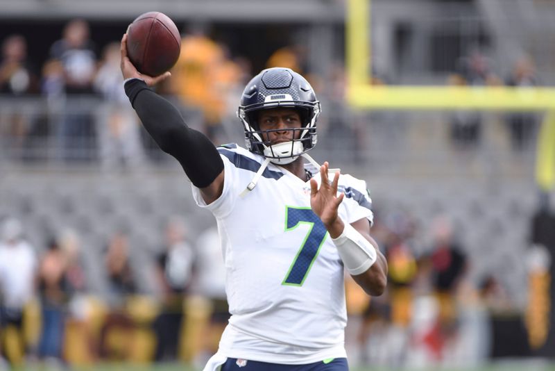 Seattle Seahawks quarterback Geno Smith (7) warms up for the team's NFL preseason football game against the Pittsburgh Steelers, Saturday, Aug. 13, 2022, in Pittsburgh. (AP Photo/Barry Reeger)