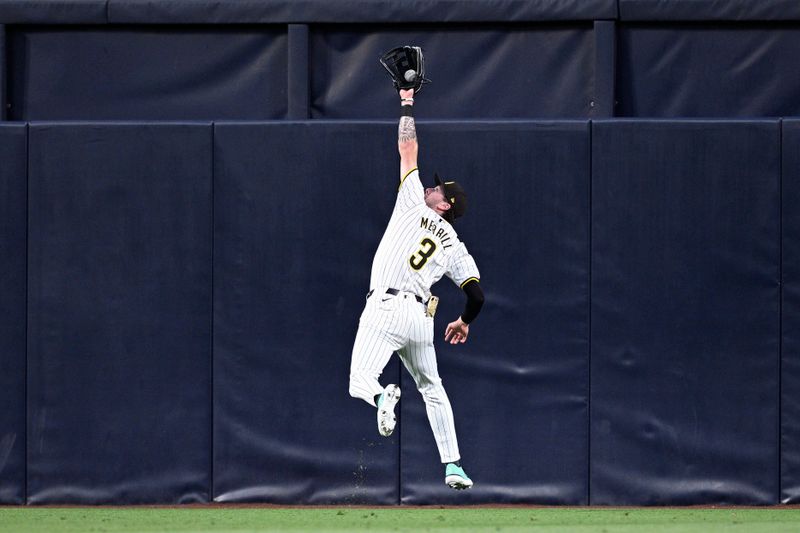 May 13, 2024; San Diego, California, USA; San Diego Padres center fielder Jackson Merrill (3) makes a leaping catch on a line drive hit by Colorado Rockies center fielder Brenton Doyle (not pictured) during the fourth inning at Petco Park. Mandatory Credit: Orlando Ramirez-USA TODAY Sports