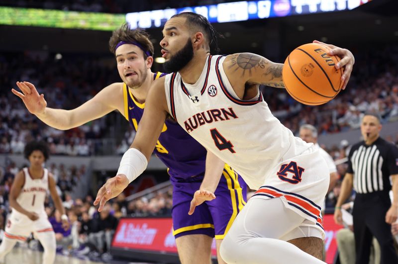 Jan 13, 2024; Auburn, Alabama, USA; Auburn Tigers forward Johni Broome (4) drives to the goal during the second half against the LSU Tigers at Neville Arena. Mandatory Credit: John Reed-USA TODAY Sports