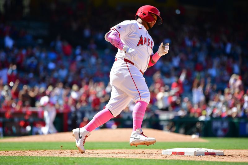 May 12, 2024; Anaheim, California, USA; Los Angeles Angels designated hitter Willie Calhoun (5) runs the bases after hitting a solo home run against the Kansas City Royals during the ninth inning at Angel Stadium. Mandatory Credit: Gary A. Vasquez-USA TODAY Sports