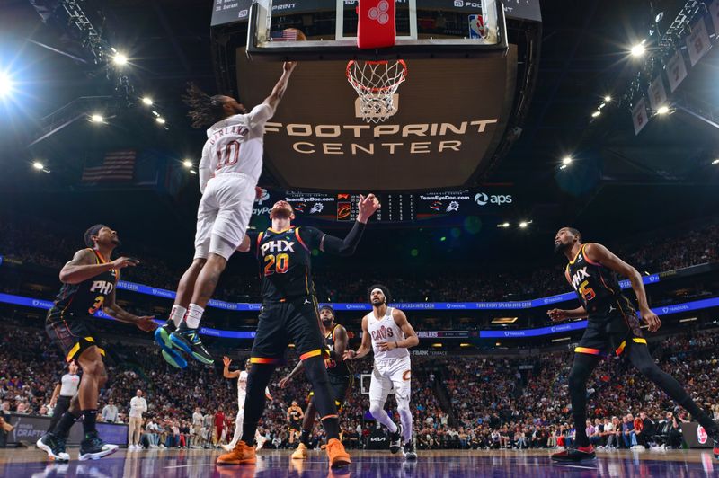 PHOENIX, AZ - APRIL  3: Darius Garland #10 of the Cleveland Cavaliers drives to the basket during the game against the Phoenix Suns on April 3, 2024 at Footprint Center in Phoenix, Arizona. NOTE TO USER: User expressly acknowledges and agrees that, by downloading and or using this photograph, user is consenting to the terms and conditions of the Getty Images License Agreement. Mandatory Copyright Notice: Copyright 2024 NBAE (Photo by Kate Frese/NBAE via Getty Images)