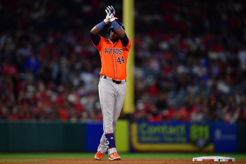 Jun 7, 2024; Anaheim, California, USA; Houston Astros outfielder Yordan Alvarez (44) reacts after hitting a three run RBI double against the Los Angeles Angels during the seventh inning at Angel Stadium. Mandatory Credit: Gary A. Vasquez-USA TODAY Sports