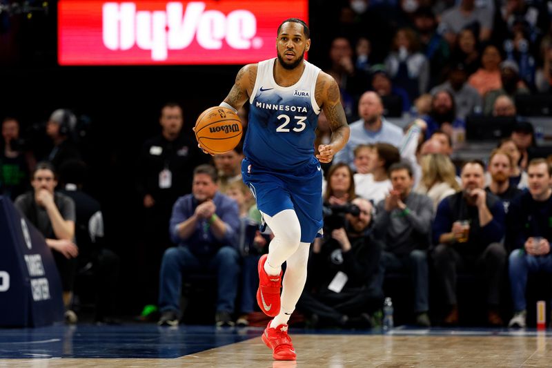 MINNEAPOLIS, MINNESOTA - MARCH 22: Monte Morris #23 of the Minnesota Timberwolves dribbles the ball against the Cleveland Cavaliers in the second quarter at Target Center on March 22, 2024 in Minneapolis, Minnesota. NOTE TO USER: User expressly acknowledges and agrees that, by downloading and or using this photograph, User is consenting to the terms and conditions of the Getty Images License Agreement. (Photo by David Berding/Getty Images)