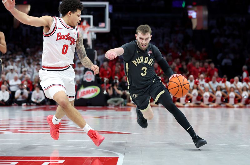 Mar 1, 2026; Columbus, Ohio, USA;  Purdue Boilermakers guard Braden Smith (3) drives to the basket as Ohio State Buckeyes guard John Mobley Jr. (0) defends during the first half at Value City Arena. Mandatory Credit: Joseph Maiorana-Imagn Images