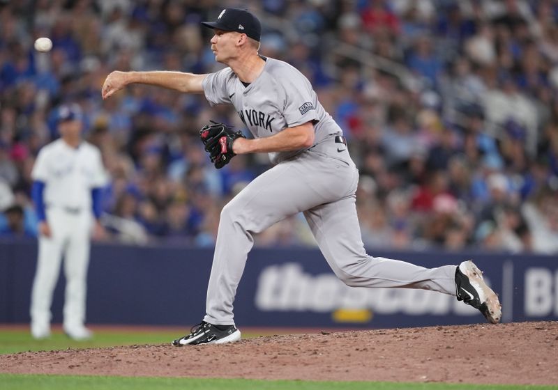 Jun 30, 2024; Toronto, Ontario, CAN; New York Yankees relief pitcher Michael Tonkin (50) throws pitch against theToronto Blue Jays during the seventh inning at Rogers Centre. Mandatory Credit: Nick Turchiaro-USA TODAY Sports