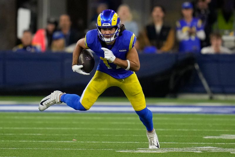 Los Angeles Rams wide receiver Puka Nacua (17) runs after a catch during the second half of an NFL football game against the New Orleans Saints, Thursday, Dec. 21, 2023, in Inglewood, Calif. (AP Photo/Ashley Landis)