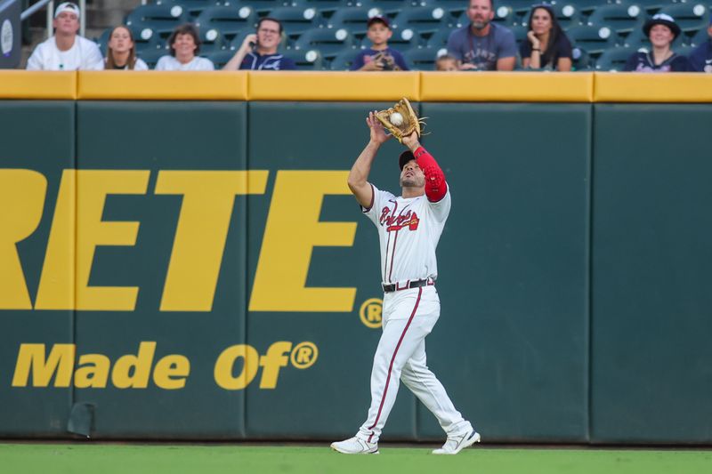 Sep 3, 2024; Atlanta, Georgia, USA; Atlanta Braves left fielder Ramon Laureano (18) catches a fly ball against the Colorado Rockies in the first inning at Truist Park. Mandatory Credit: Brett Davis-Imagn Images 
