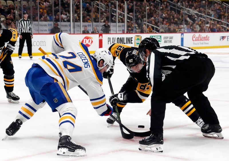 Jan 6, 2024; Pittsburgh, Pennsylvania, USA;  Buffalo Sabres center Dylan Cozens (24) takes a face-off against Pittsburgh Penguins center Sidney Crosby (87) during the third period at PPG Paints Arena. Buffalo won 3-1. Mandatory Credit: Charles LeClaire-USA TODAY Sports