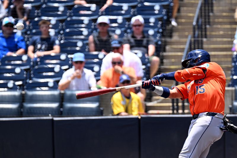 May 21, 2025; St. Petersburg, Florida, USA; Houston Astros third baseman Isaac Paredes (15) hits a two run home run in the first inning against the Tampa Bay Rays  at George M. Steinbrenner Field. Mandatory Credit: Jonathan Dyer-Imagn Images
