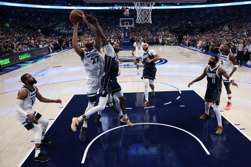 DALLAS, TEXAS - MAY 26: Rudy Gobert #27 of the Minnesota Timberwolves shoots the ball against Derrick Jones Jr. #55 of the Dallas Mavericks during the second quarter in Game Three of the Western Conference Finals at American Airlines Center on May 26, 2024 in Dallas, Texas. NOTE TO USER: User expressly acknowledges and agrees that, by downloading and or using this photograph, User is consenting to the terms and conditions of the Getty Images License Agreement. (Photo by Matthew Stockman/Getty Images)