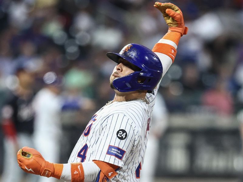 Jul 9, 2024; New York City, New York, USA;  New York Mets catcher Francisco Alvarez (4) gestures after hitting a single in the fifth inning against the Washington Nationals at Citi Field. Mandatory Credit: Wendell Cruz-USA TODAY Sports