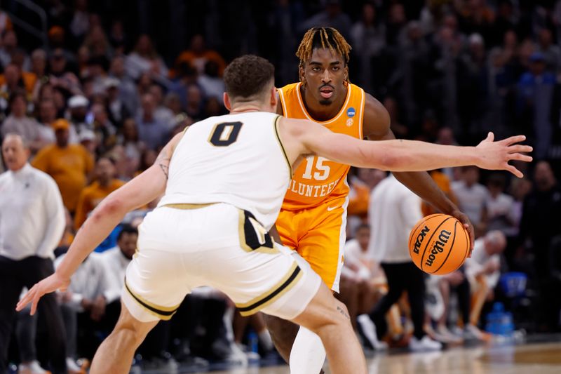 Mar 31, 2024; Detroit, MI, USA; Tennessee Volunteers guard Jahmai Mashack (15) plays the ball defended by Purdue Boilermakers forward Mason Gillis (0) in the first half during the NCAA Tournament Midwest Regional Championship at Little Caesars Arena. Mandatory Credit: Rick Osentoski-USA TODAY Sports