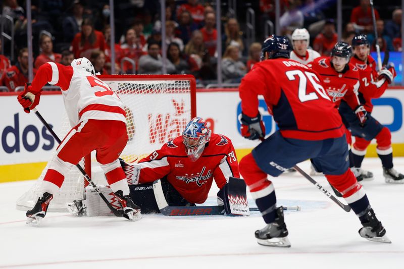 Sep 28, 2023; Washington, District of Columbia, USA; Washington Capitals goaltender Charlie Lindgren (79) makes a save on Detroit Red Wings forward Domink Shine (50) in the second period at Capital One Arena. Mandatory Credit: Geoff Burke-USA TODAY Sports