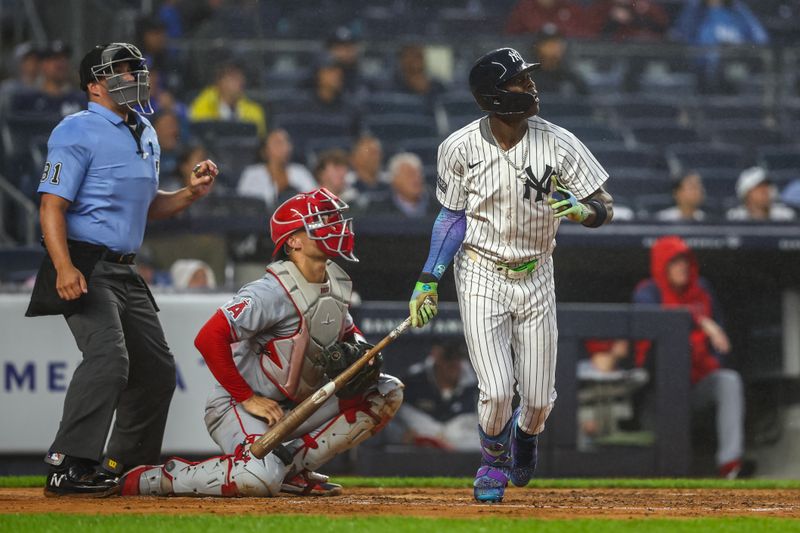 Aug 8, 2024; Bronx, New York, USA;  New York Yankees third baseman Jazz Chisholm Jr. (13) hits a solo home run in the second inning against the Los Angeles Angels at Yankee Stadium. Mandatory Credit: Wendell Cruz-USA TODAY Sports