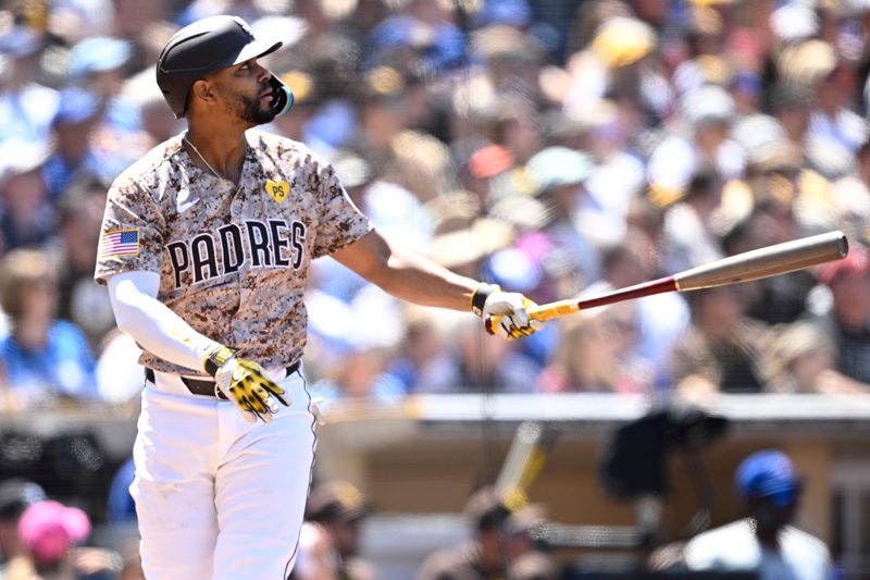 Apr 21, 2024; San Diego, California, USA; San Diego Padres second baseman Xander Bogaerts (2) hits a home run against the Toronto Blue Jays during the third inning at Petco Park. Mandatory Credit: Orlando Ramirez-USA TODAY Sports