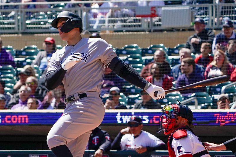 Apr 26, 2023; Minneapolis, Minnesota, USA; New York Yankees designated hitter Aaron Judge (99) hits a double against the Minnesota Twins during the first inning at Target Field. Mandatory Credit: Nick Wosika-USA TODAY Sports

