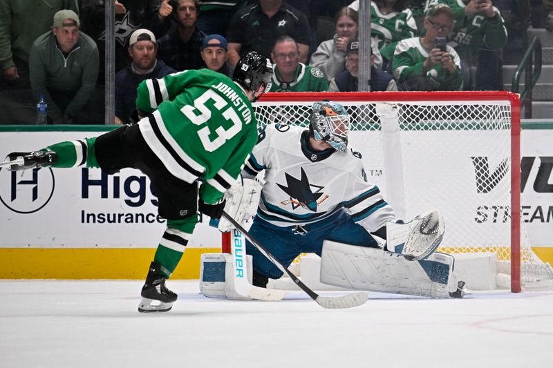 Oct 15, 2024; Dallas, Texas, USA; Dallas Stars center Wyatt Johnston (53) scores a goal against San Jose Sharks goaltender Mackenzie Blackwood (29) during the overtime shootout period at the American Airlines Center. Mandatory Credit: Jerome Miron-Imagn Images