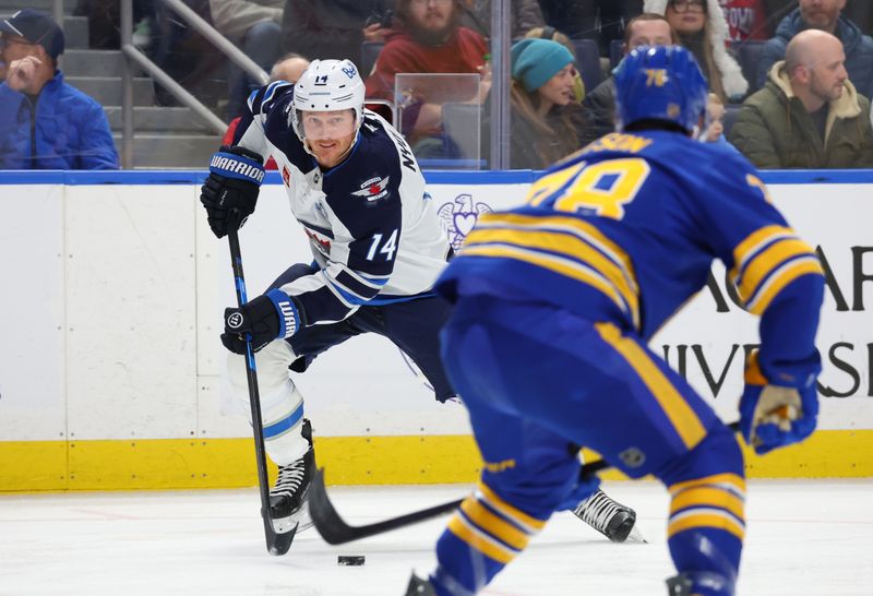 Dec 1, 2025; Buffalo, New York, USA;  Winnipeg Jets right wing Gustav Nyquist (14) looks to make a pass during the first period against the Buffalo Sabres at KeyBank Center. Mandatory Credit: Timothy T. Ludwig-Imagn Images