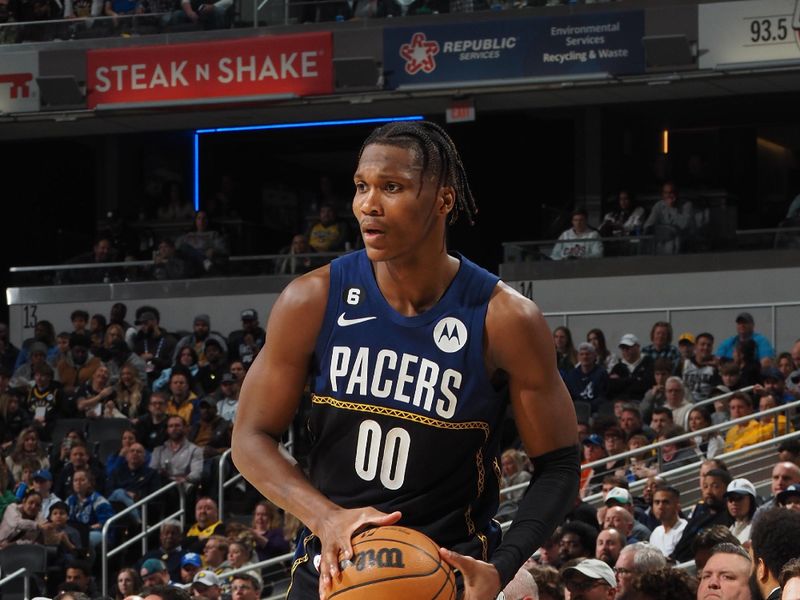 INDIANAPOLIS, IN - MARCH 27: Bennedict Mathurin #00 of the Indiana Pacers handles the ball during the game against the Dallas Mavericks on March 27, 2023 at Gainbridge Fieldhouse in Indianapolis, Indiana. NOTE TO USER: User expressly acknowledges and agrees that, by downloading and or using this Photograph, user is consenting to the terms and conditions of the Getty Images License Agreement. Mandatory Copyright Notice: Copyright 2023 NBAE (Photo by Ron Hoskins/NBAE via Getty Images)