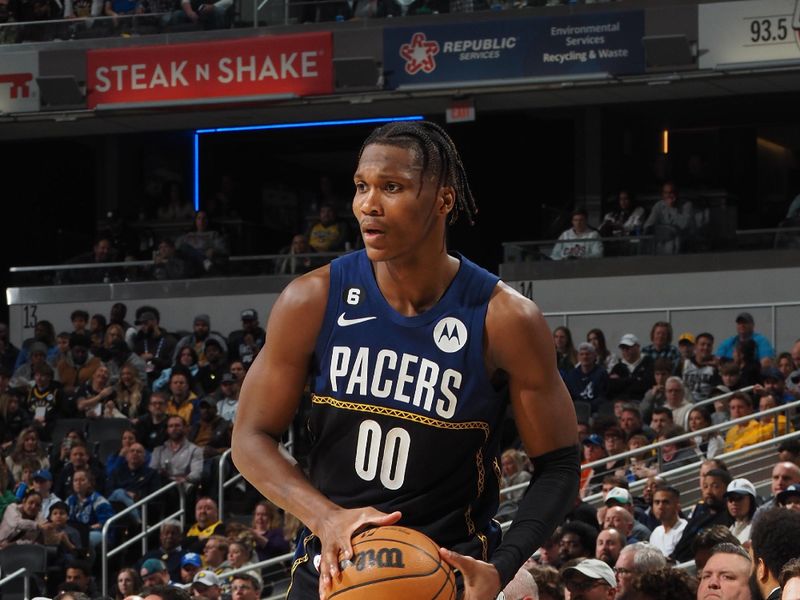 INDIANAPOLIS, IN - MARCH 27: Bennedict Mathurin #00 of the Indiana Pacers handles the ball during the game against the Dallas Mavericks on March 27, 2023 at Gainbridge Fieldhouse in Indianapolis, Indiana. NOTE TO USER: User expressly acknowledges and agrees that, by downloading and or using this Photograph, user is consenting to the terms and conditions of the Getty Images License Agreement. Mandatory Copyright Notice: Copyright 2023 NBAE (Photo by Ron Hoskins/NBAE via Getty Images)