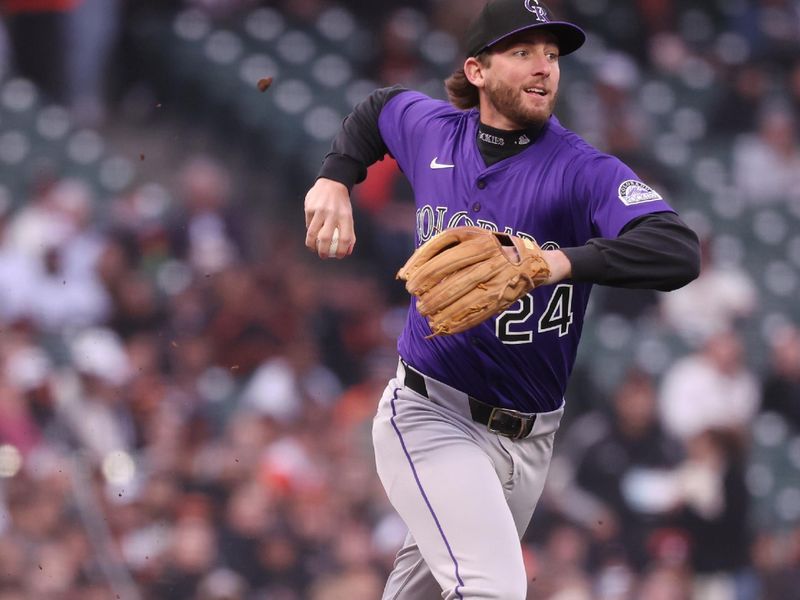 May 2, 2025; San Francisco, California, USA;  Colorado Rockies third baseman Ryan McMahon (24) throws the ball to first base against the San Francisco Giants during the first inning at Oracle Park. Mandatory Credit: Kelley L Cox-Imagn Images