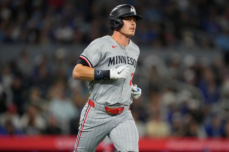 May 10, 2024; Toronto, Ontario, CAN; Minnesota Twins outfielder Max Kepler (26) runs to first base on a one-run single against the Toronto Blue Jays during the ninth inning at Rogers Centre. Mandatory Credit: John E. Sokolowski-USA TODAY Sports