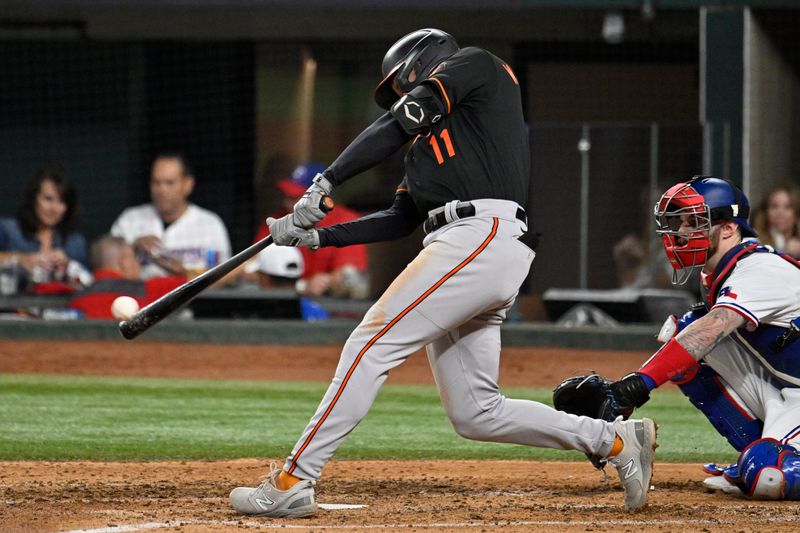 Oct 10, 2023; Arlington, Texas, USA; Baltimore Orioles second baseman Jordan Westburg (11) hits a single against the Texas Rangers in the fifth inning during game three of the ALDS for the 2023 MLB playoffs at Globe Life Field. Mandatory Credit: Jerome Miron-USA TODAY Sports