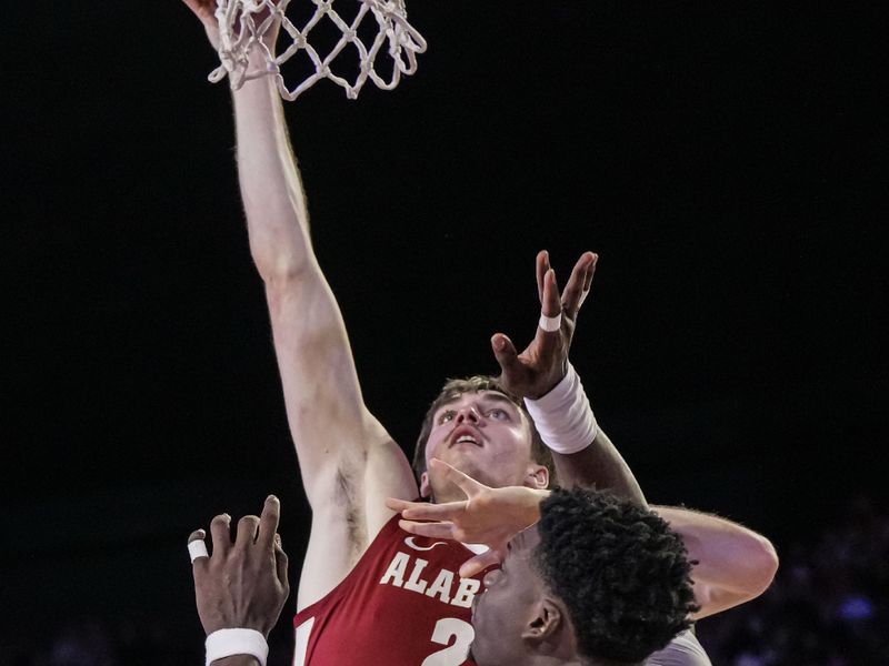 Jan 31, 2024; Athens, Georgia, USA; Alabama Crimson Tide forward Grant Nelson (2) shoots over Georgia Bulldogs center Russel Tchewa (54) during the second half at Stegeman Coliseum. Mandatory Credit: Dale Zanine-USA TODAY Sports