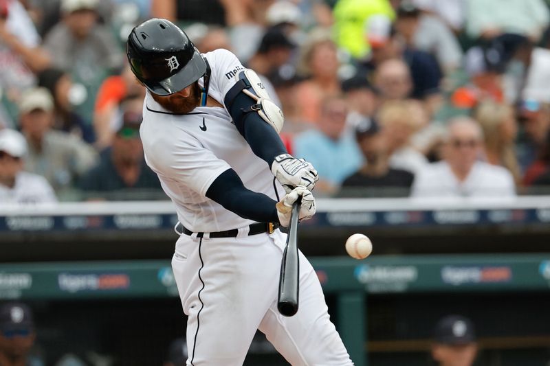 Aug 6, 2023; Detroit, Michigan, USA; Detroit Tigers catcher Eric Haase (13) hits an RBI single in the second inning against the Tampa Bay Rays at Comerica Park. Mandatory Credit: Rick Osentoski-USA TODAY Sports