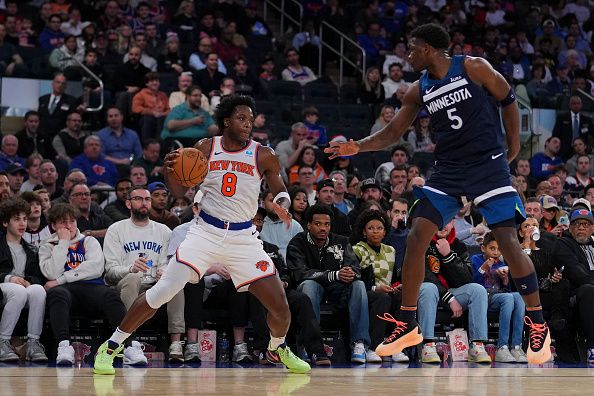 NEW YORK, NEW YORK - JANUARY 1: OG Anunoby #8 of the New York Knicks dribbles the ball against Anthony Edwards #5 of the Minnesota Timberwolves in the second half at Madison Square Garden on January 1, 2024 in New York City. The Knicks defeated the Timberwolves 112-106. NOTE TO USER: User expressly acknowledges and agrees that, by downloading and or using this photograph, User is consenting to the terms and conditions of the Getty Images License Agreement. (Photo by Mitchell Leff/Getty Images)