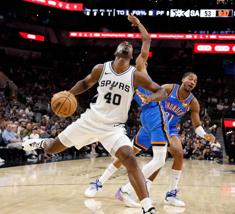 SAN ANTONIO, TX - OCTOBER 07:  Harrison Barnes #40 of the San Antonio Spurs reacts after being fouled during action against the Oklahoma City Thunder in the second half of a preseason game at Frost Bank Center on October 7, 2024 in San Antonio, Texas. NOTE TO USER: User expressly acknowledges and agrees that, by downloading and or using this photograph, User is consenting to terms and conditions of the Getty Images License Agreement. (Photo by Ronald Cortes/Getty Images)